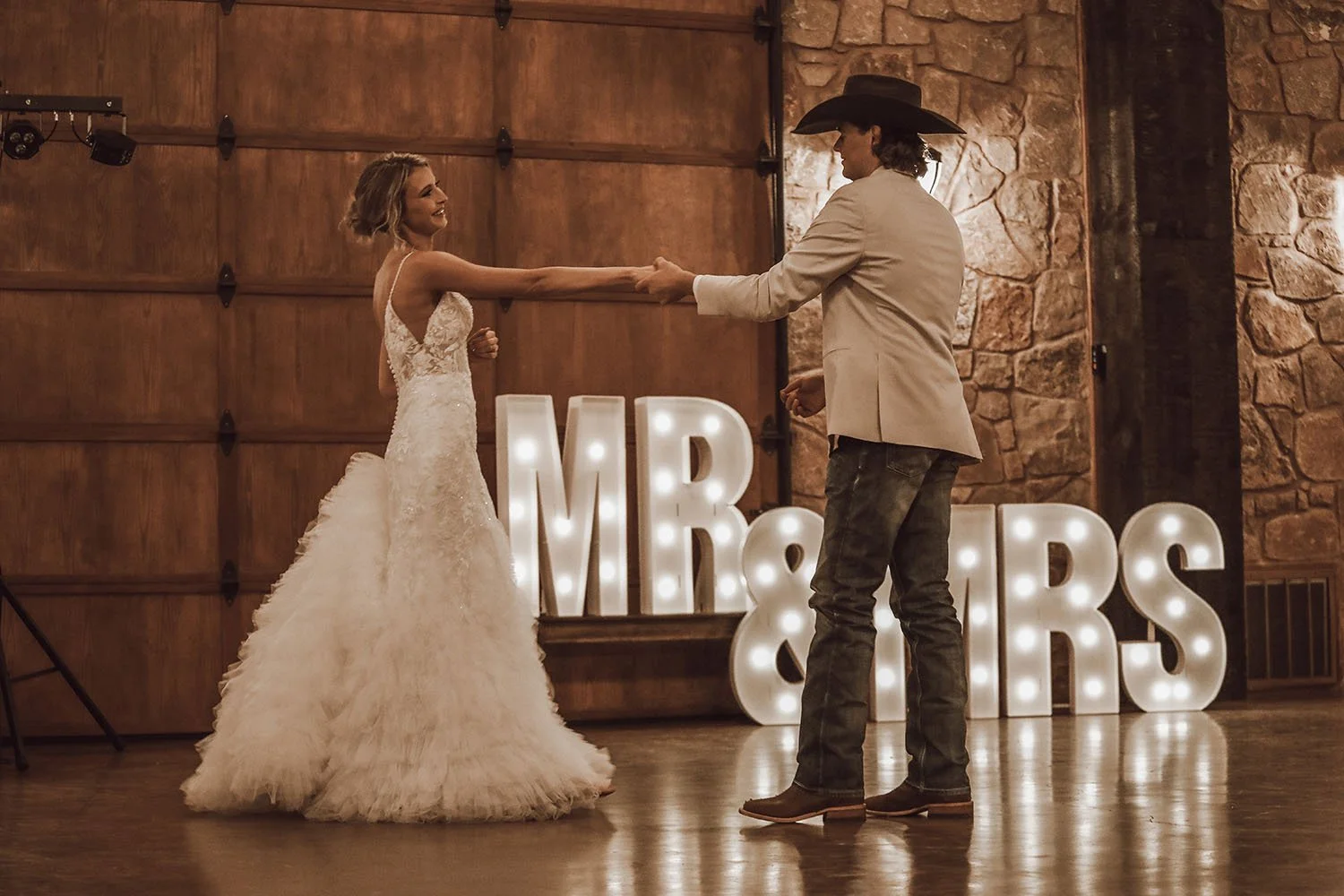 Couple first dance with LED Mr. & Mrs. signs