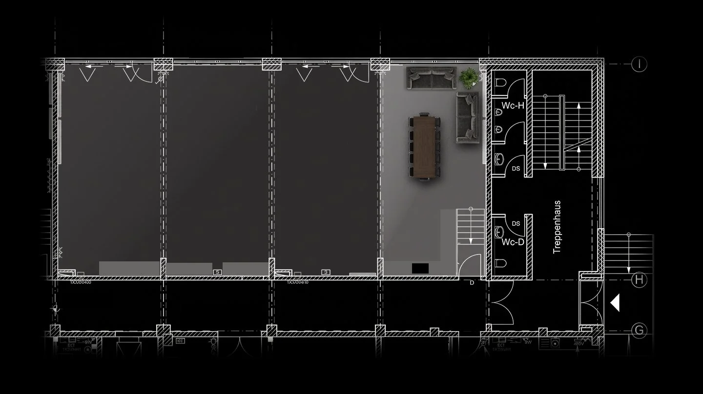 Floor plan of a building showing multiple rooms, a living area with sofas and a dining table, and restroom facilities labeled Wc-H and Wc-D.