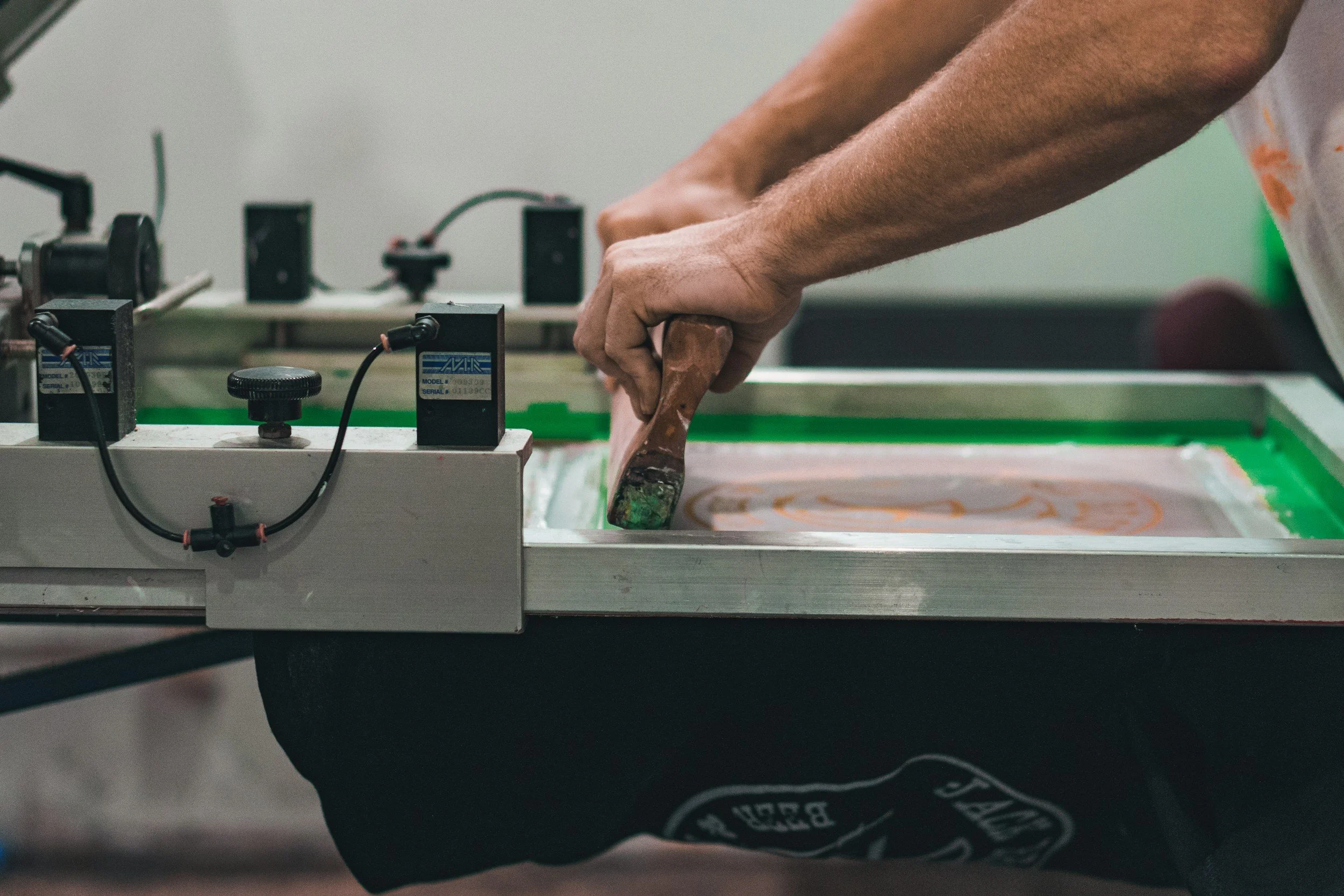 Water-based screen printing a custom T-shirt at the Peach Street studio in Dublin.