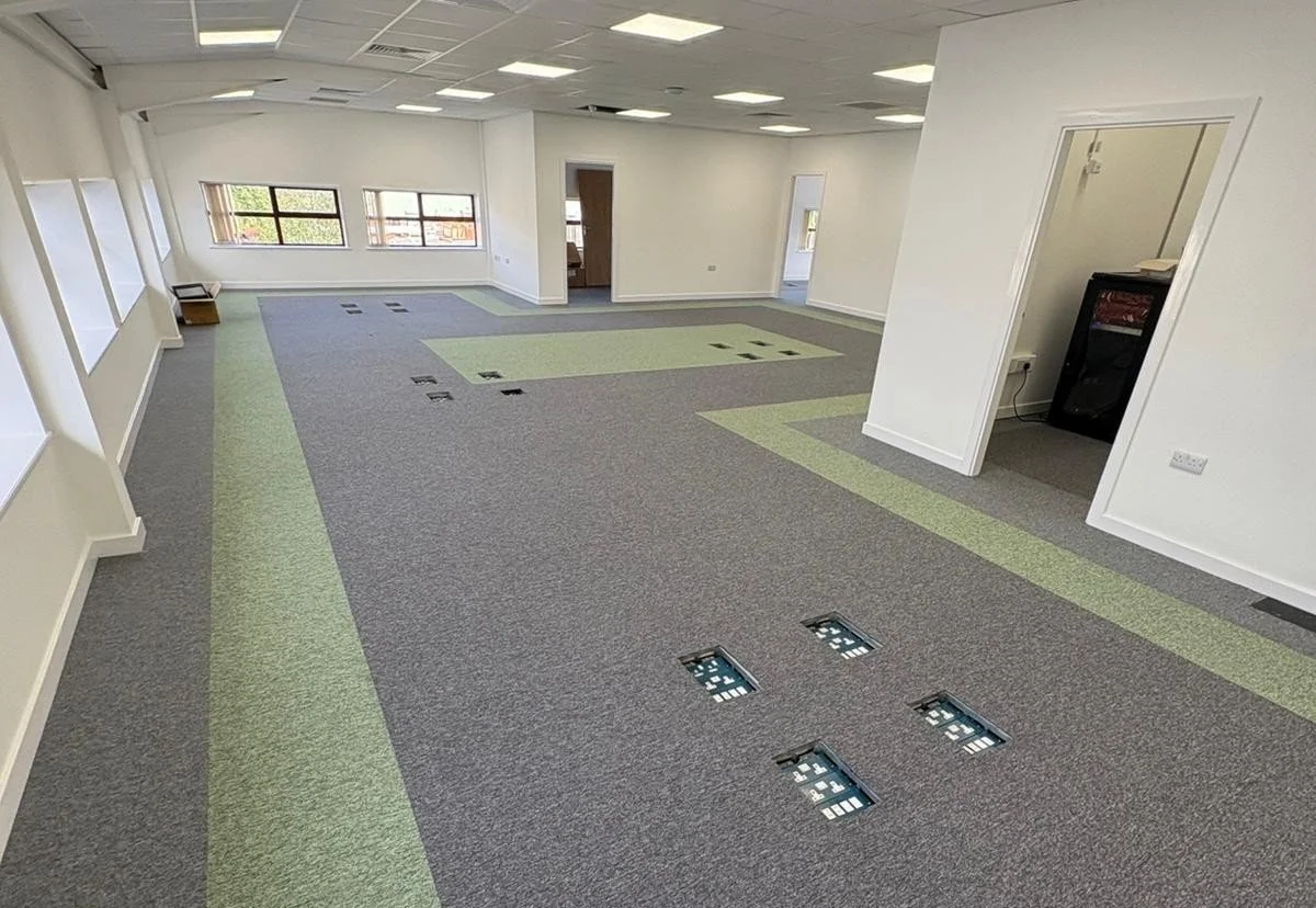 Brand-matched office flooring at Robinson Contract Services