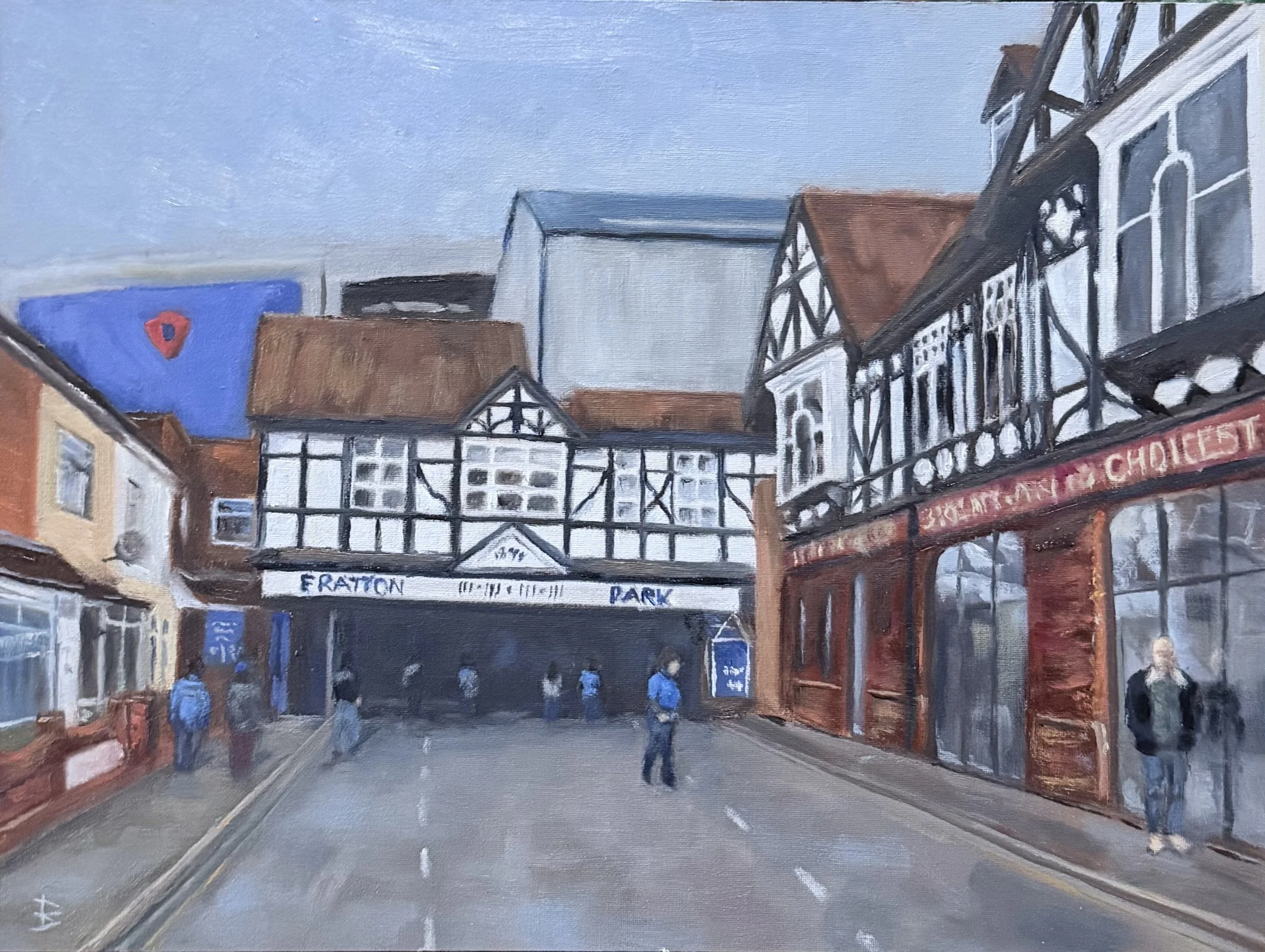 A painted street scene of Portsmouth Football ground featuring traditional timber-framed buildings, a few people walking, with a cloudy sky overhead.