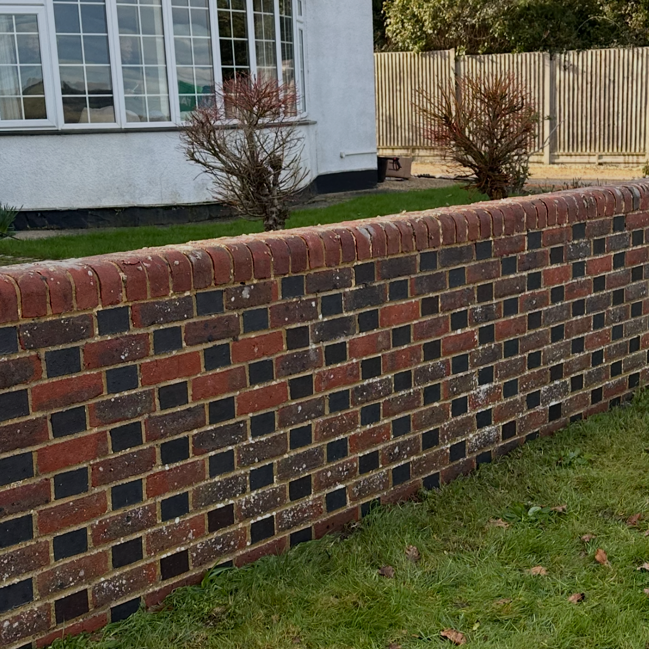 After photo of soft wash of a brick wall to bring the colour back to life and remove moss, dirt and algae. 