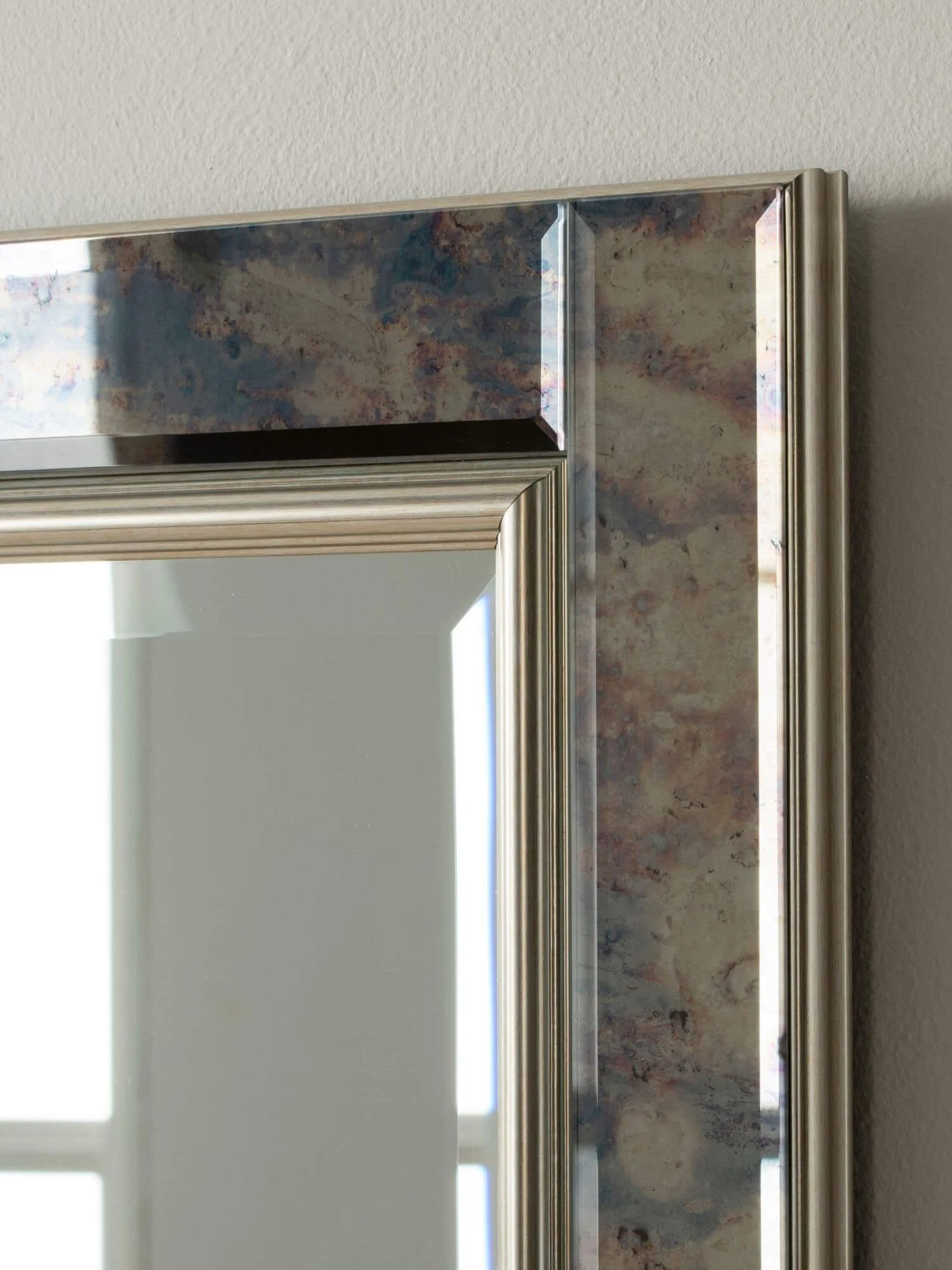 Close-up of antique silver wall mirror