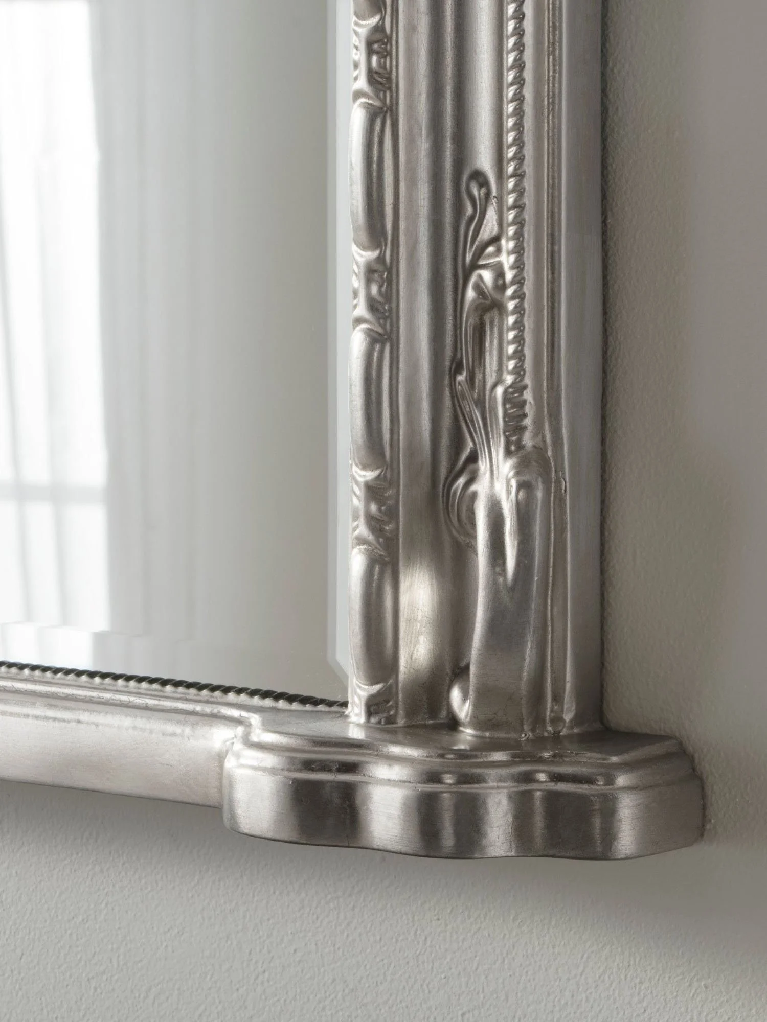 Ornate arched overmantel mirror by Yearn Mirrors London in silver