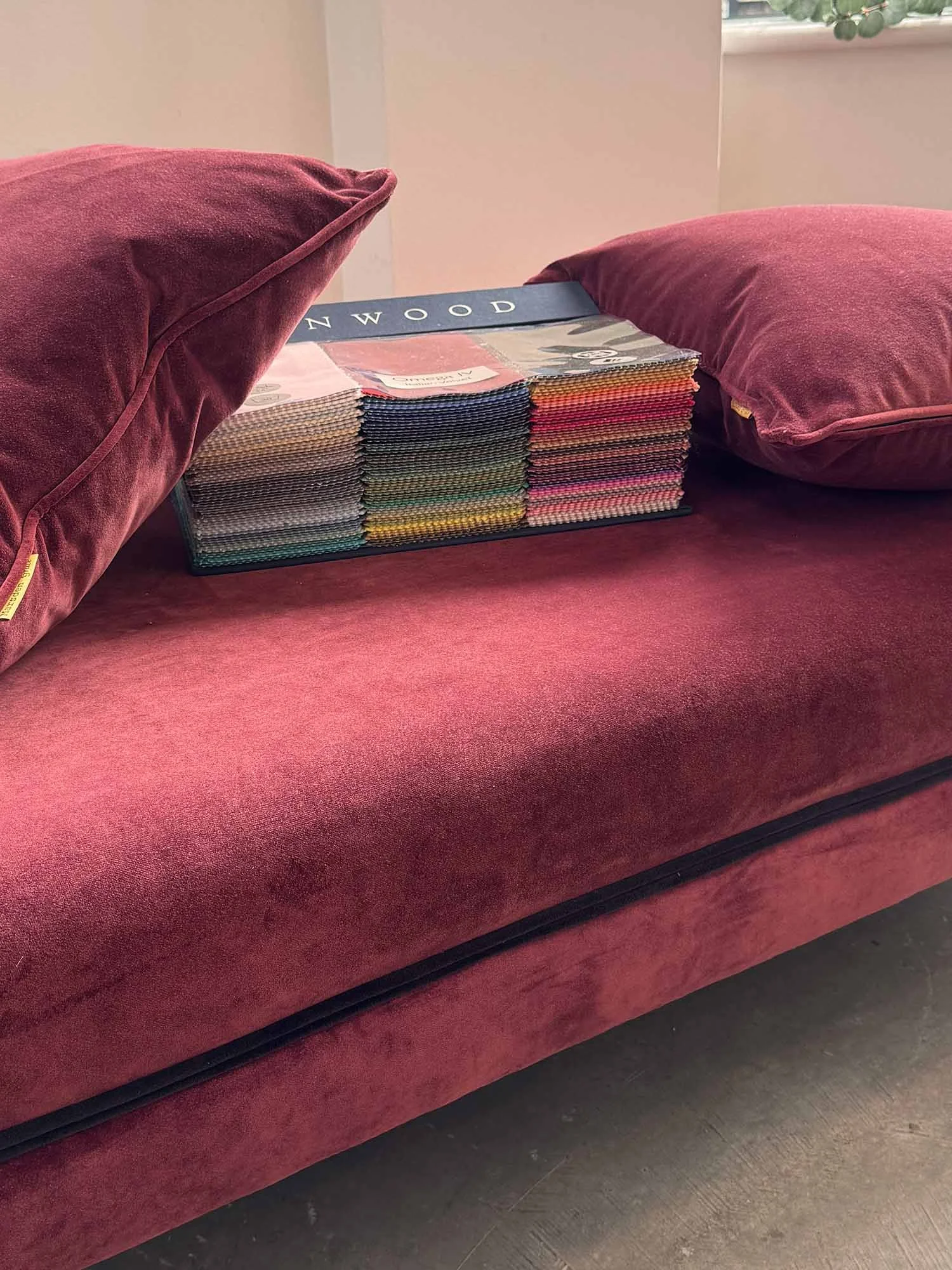 Linwood fabric book in-between two velvet cushions (Copy)
