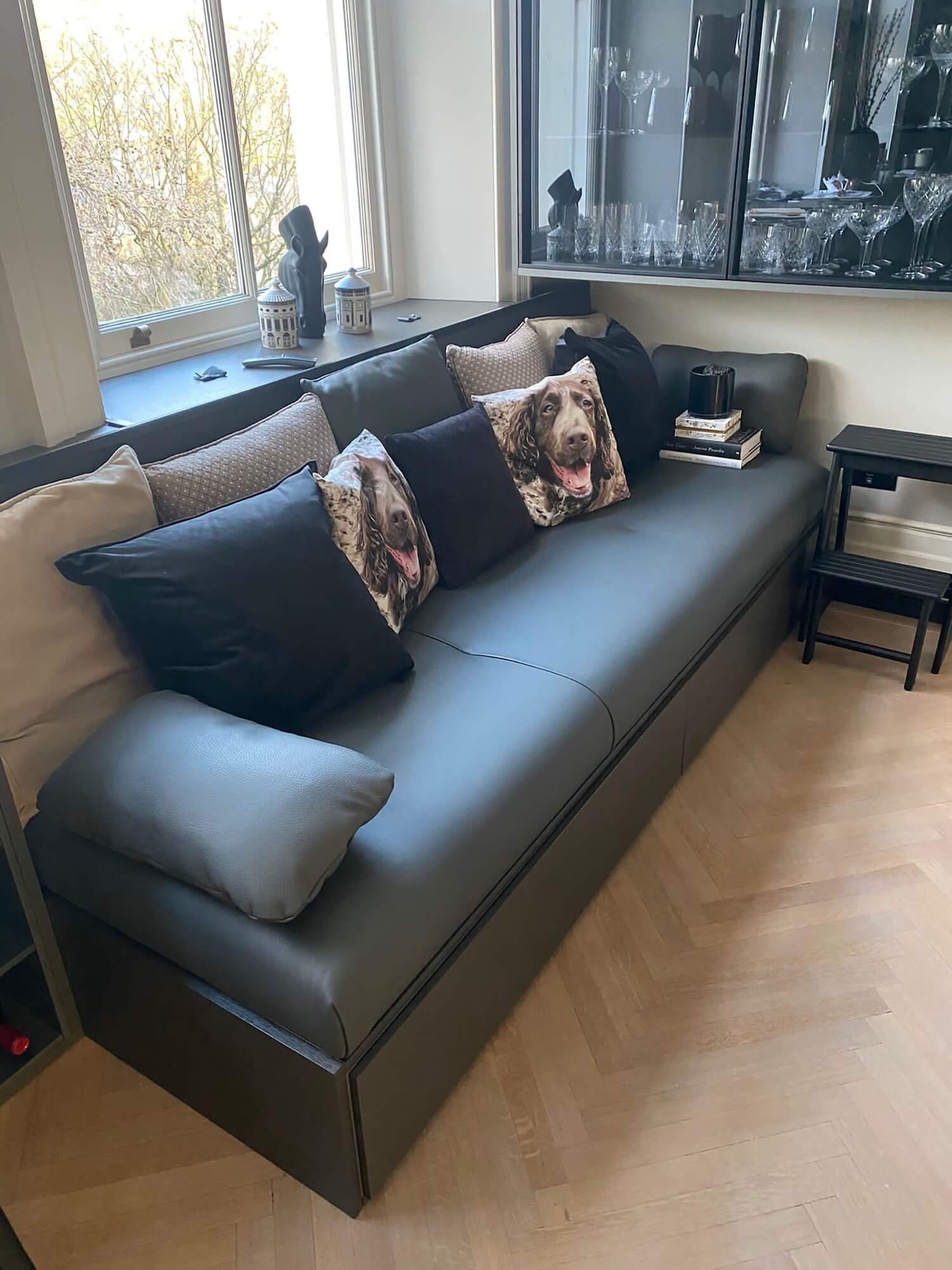 Dark grey sofa with patterned cushions