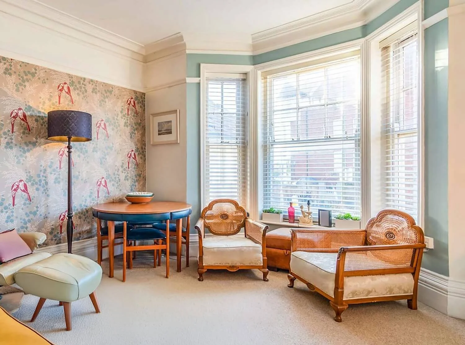 Edwardian living room with high ceilings and vintage furniture