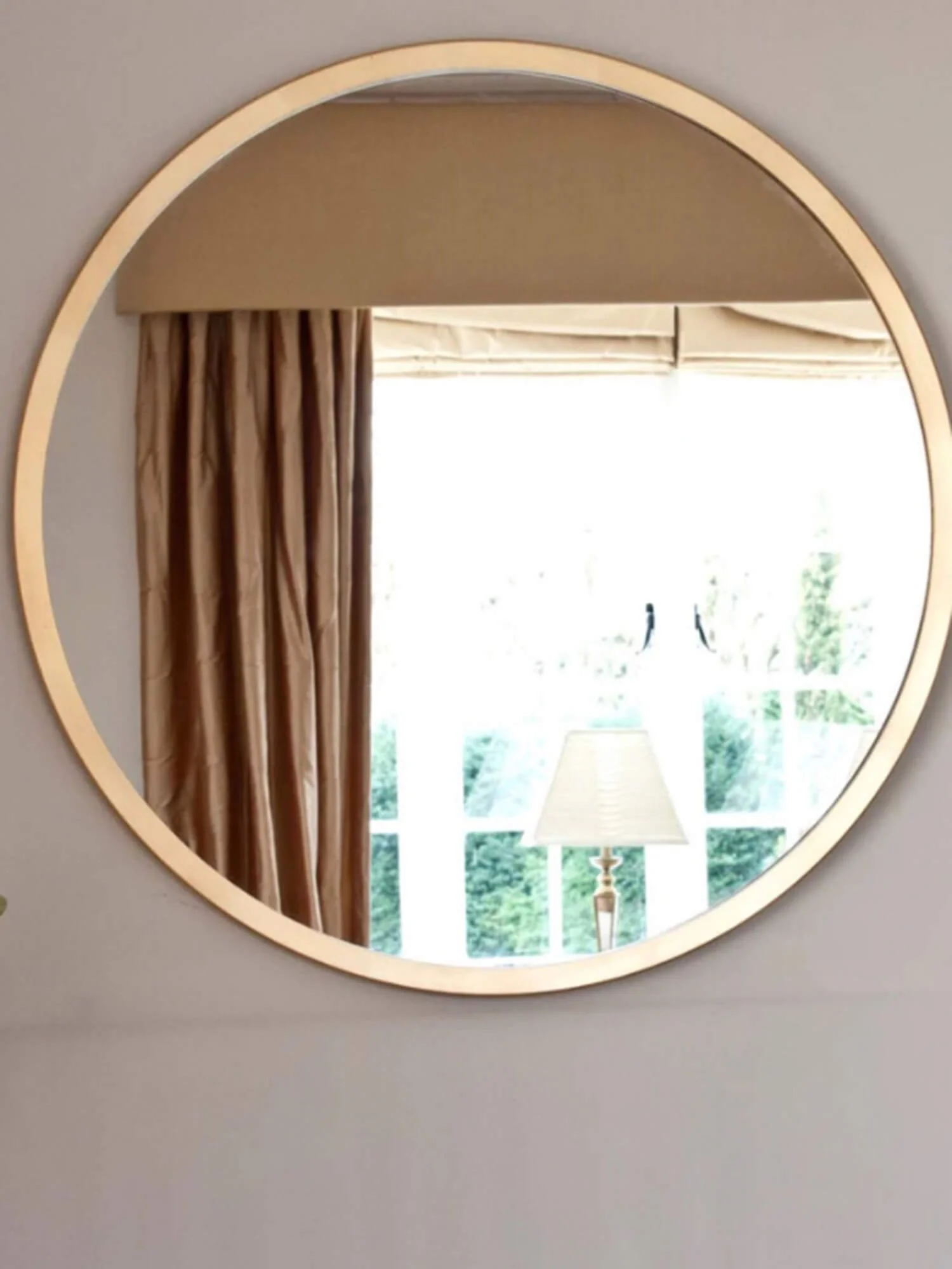 Large gold coloured wall mirror
