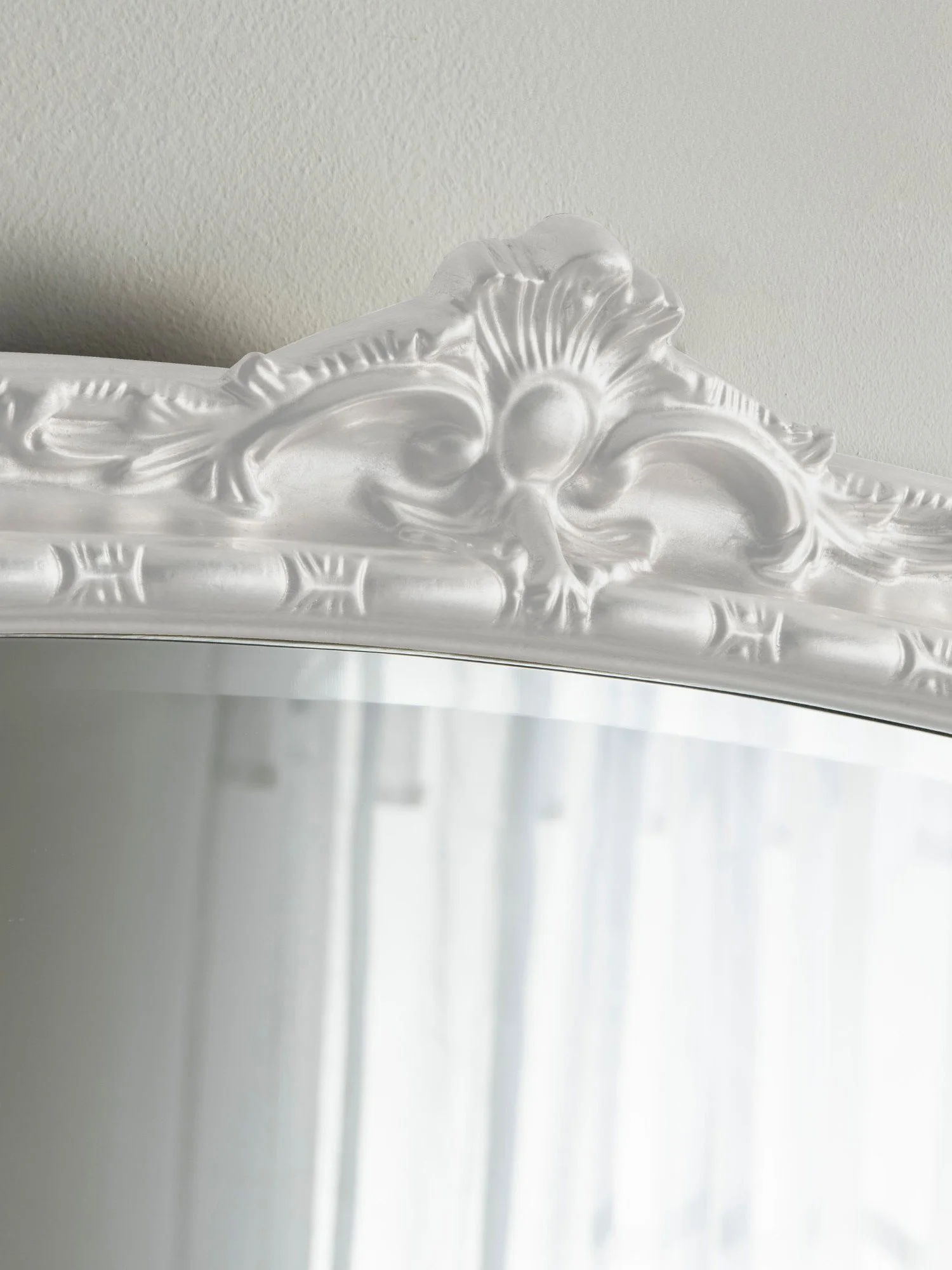 Ornate arched overmantel mirror by Yearn Mirrors London in white