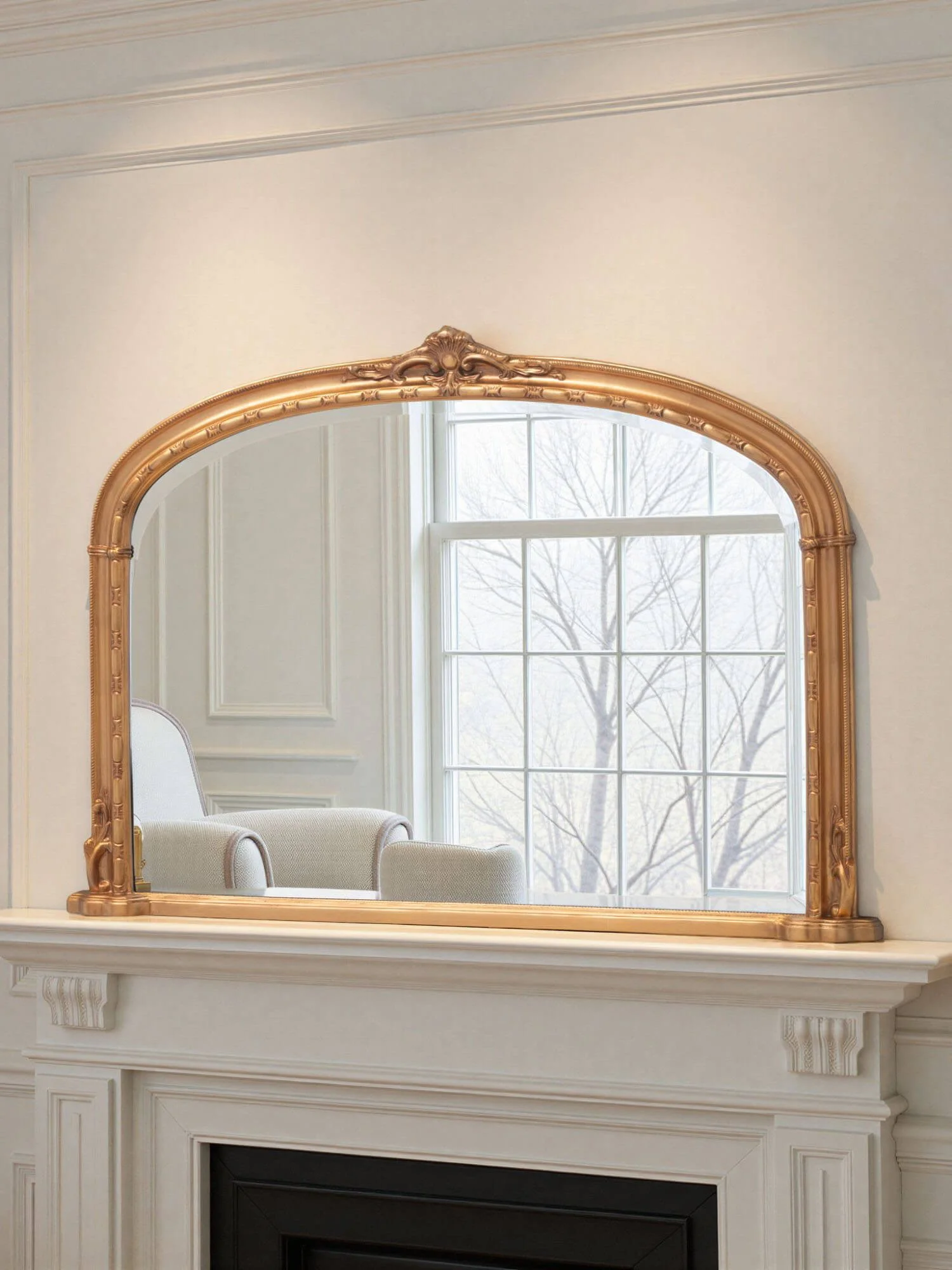 Ornate arched overmantel mirror by Yearn Mirrors London in gold