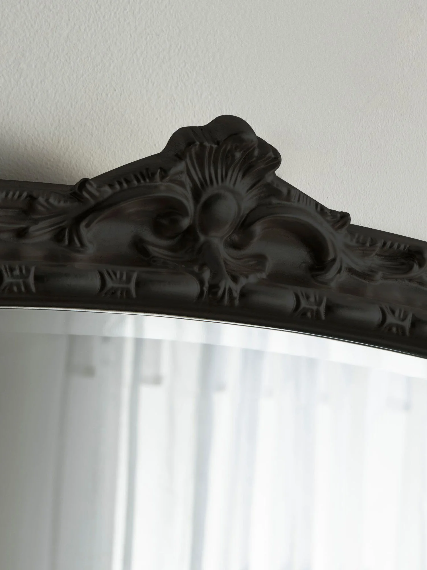 Ornate arched overmantel mirror by Yearn Mirrors London in black