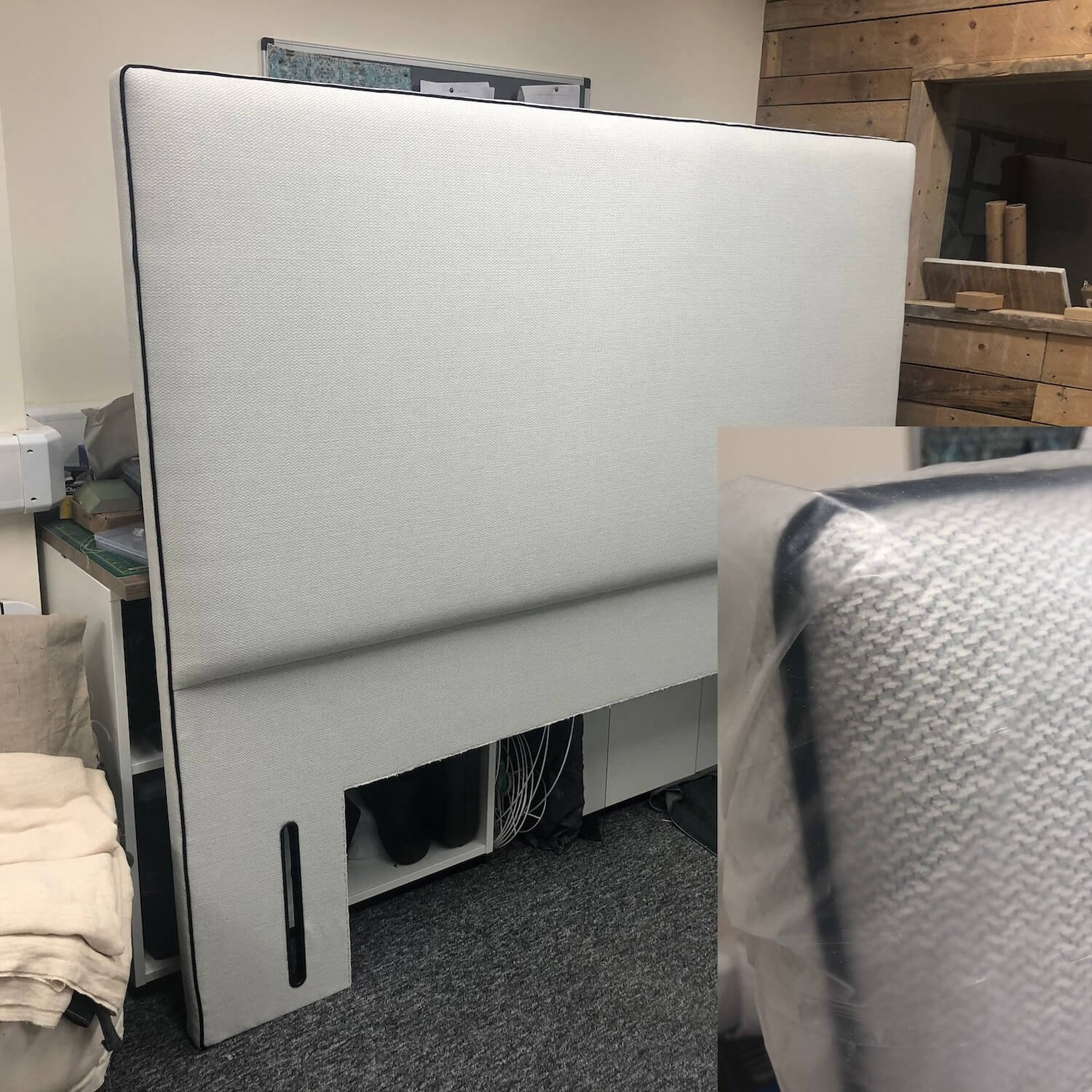 Tall modern upholstered headboard in soft grey fabric