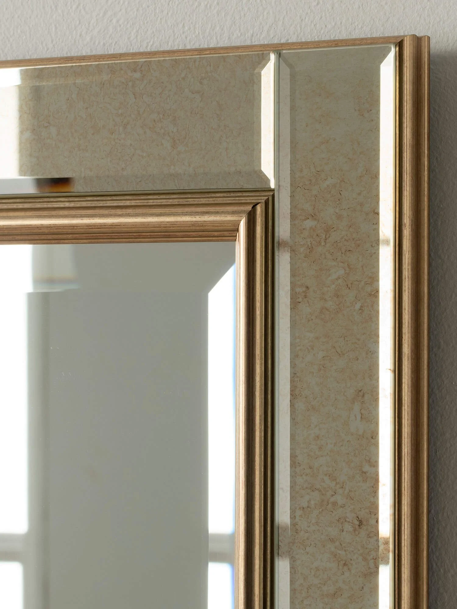 Close-up antique gold wall mirror