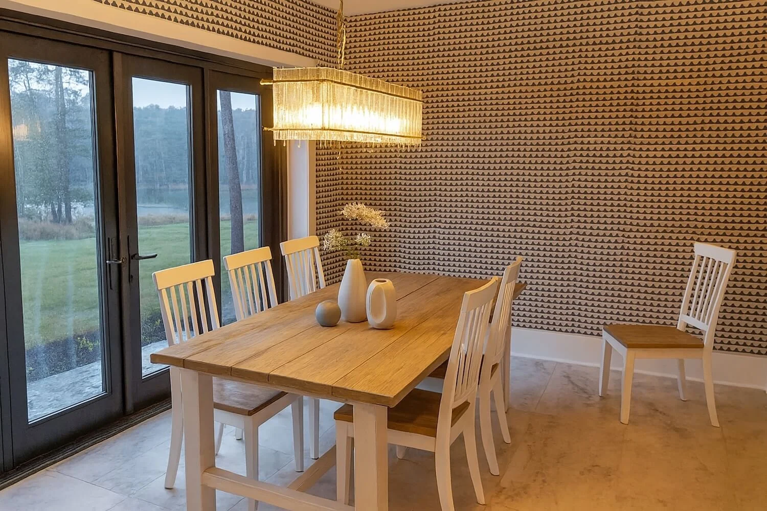 dining room photo with patterned wallpaper and oak furniture