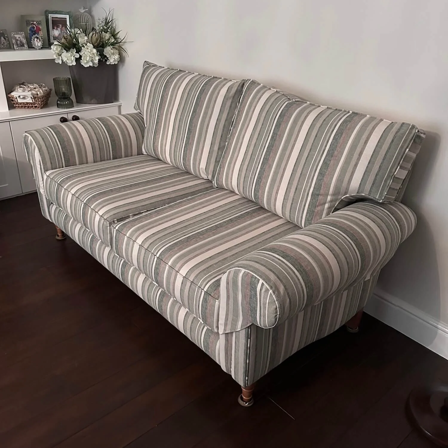 Striped contemporary sofa newly upholstered in grey and white fabric