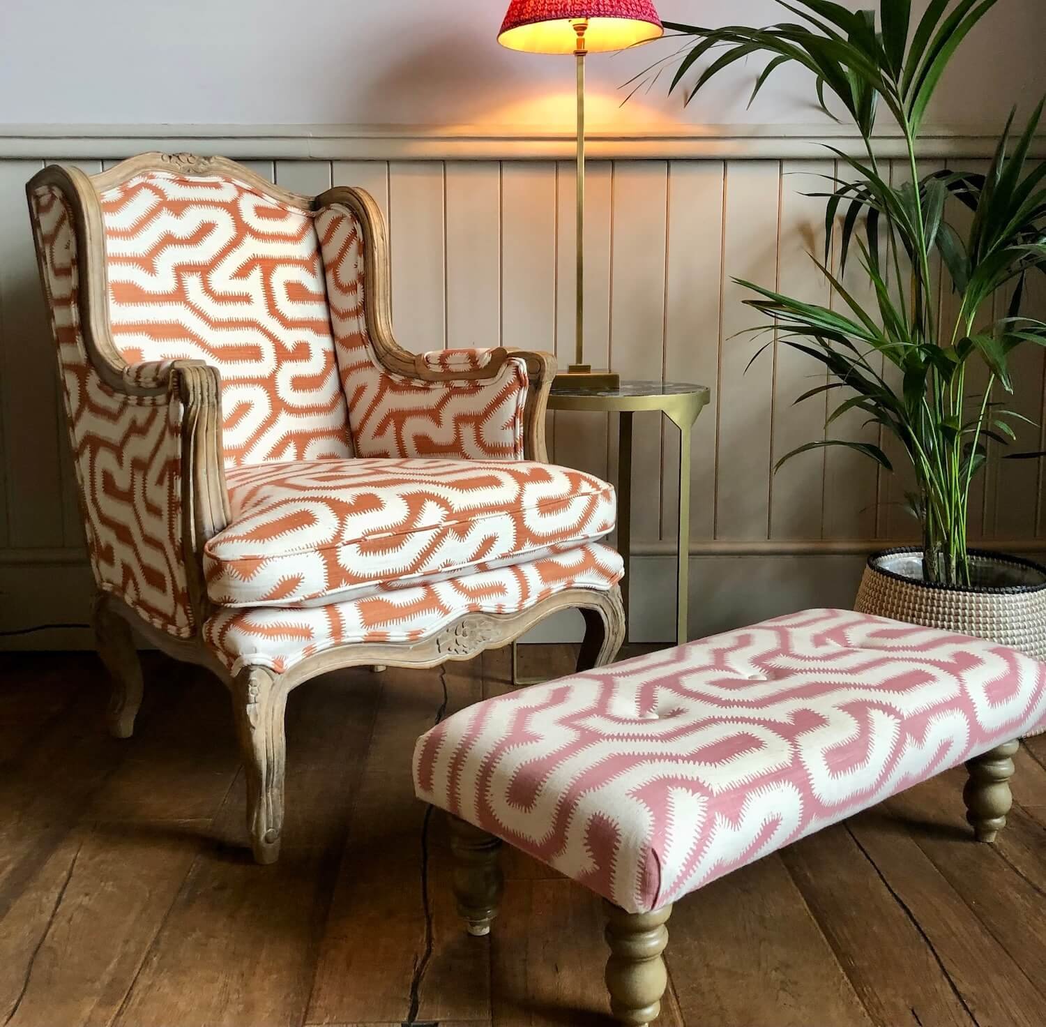 Vintage upholstered chair and footstool restored in patterned fabric