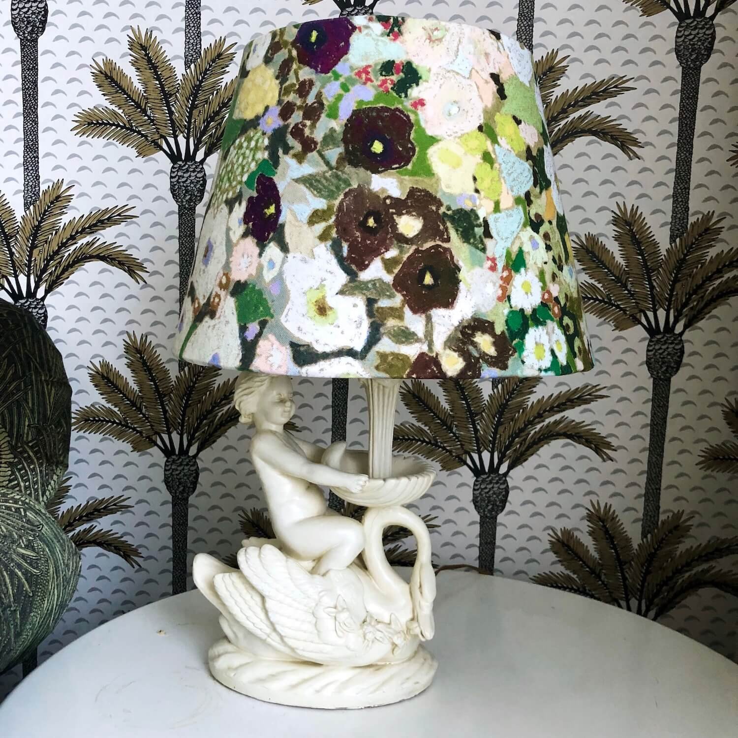 Decorative lamp with sculptural ceramic base and patterned shade