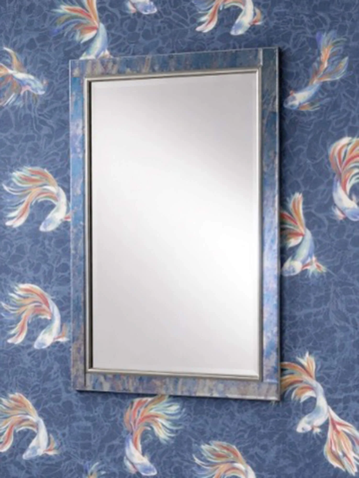 Antique silver wall mirror on blue wallpaper with fish design