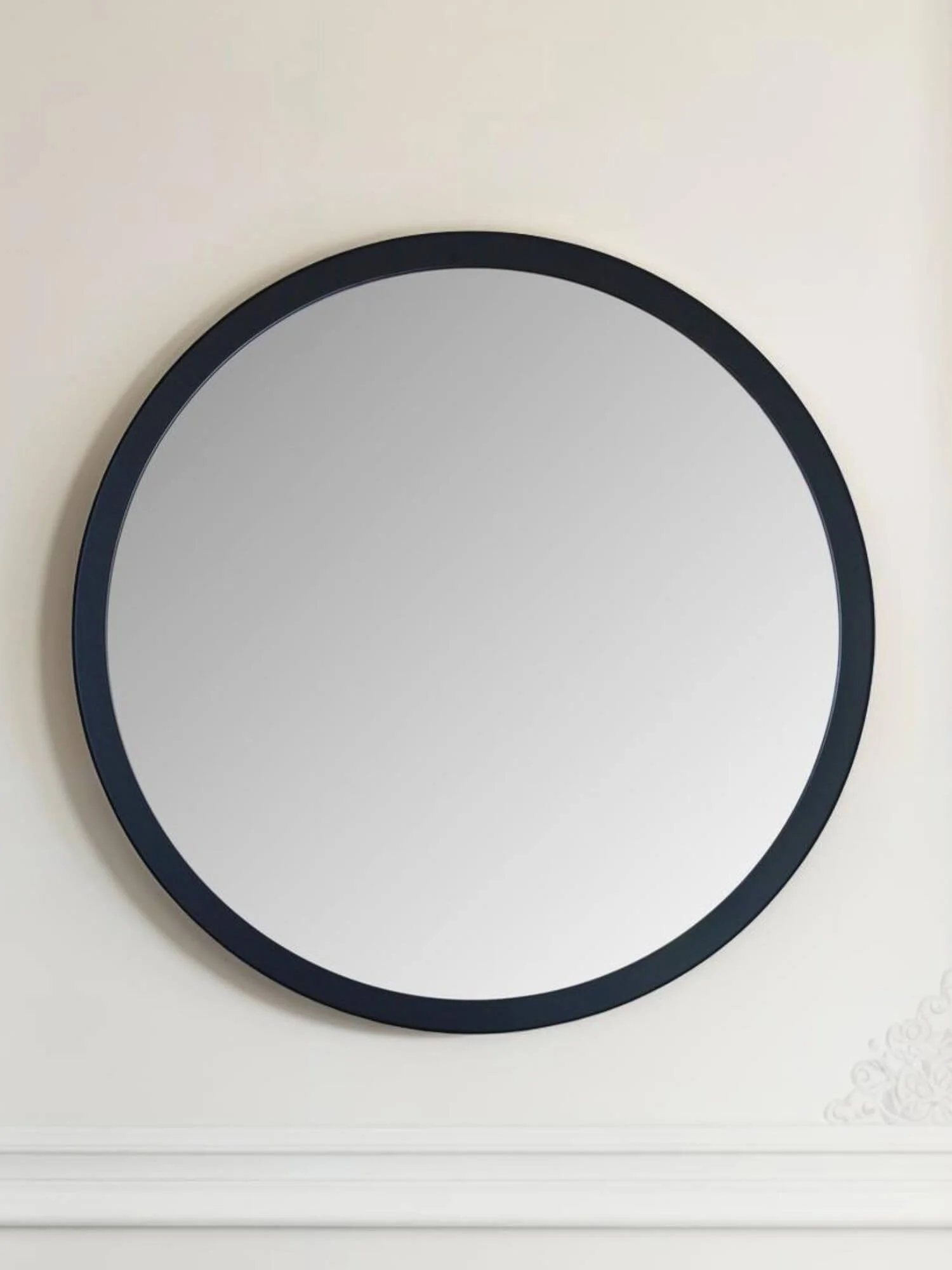 Large round black wall mirror