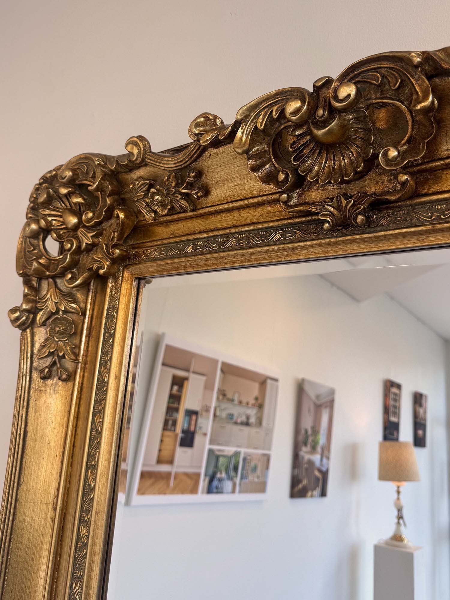 Close up of antique style regal tall mirror corner detail