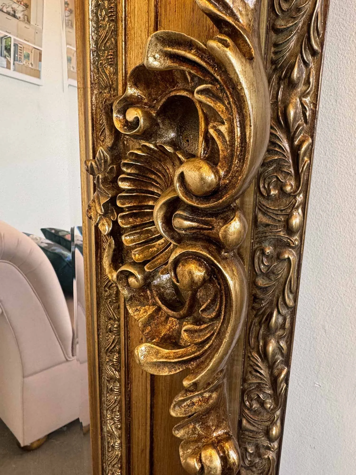 Close up of tall regal mirror ornate detail