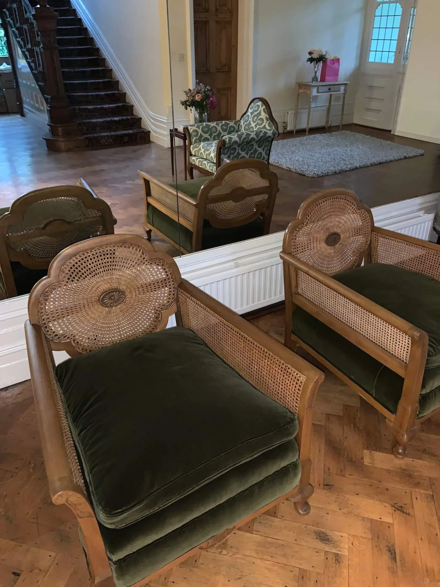 Restored pair of mid-century chairs with green velvet seat cushions