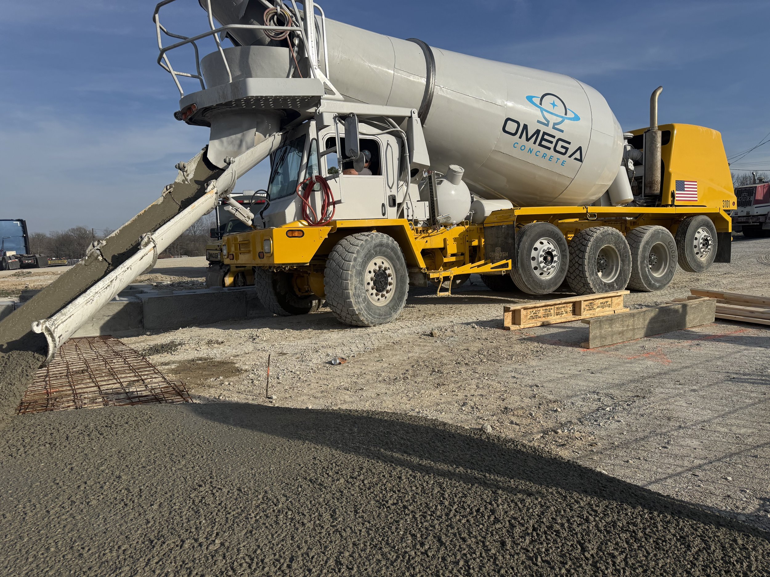 ready-mix concrete mixer truck pouring concrete