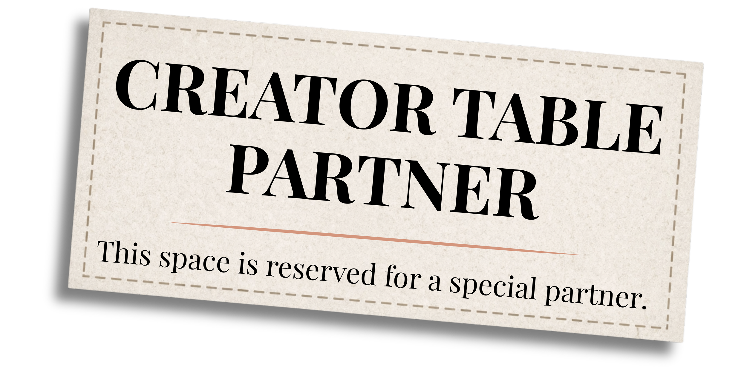 A sign that says 'Creator Table Partner' with additional text indicating the space is reserved for a special partner.