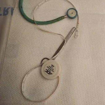 A stethoscope rests against white cloth