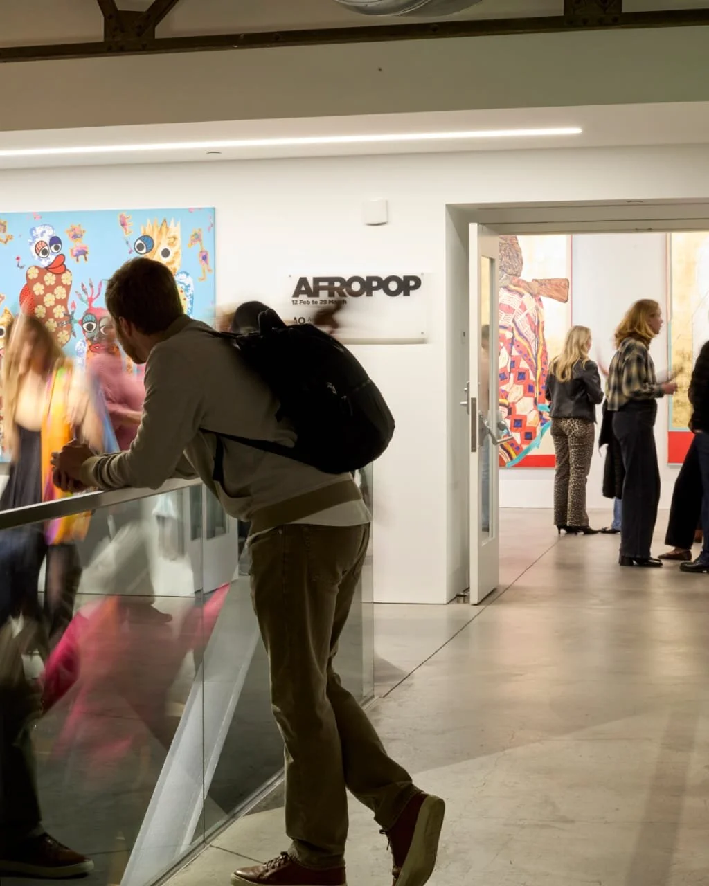 Opening event at Minnesota Street Project for the AFROPPOP exhibition, with colorful contemporary African artwork at Art of Contemporary Africa gallery in San Francisco