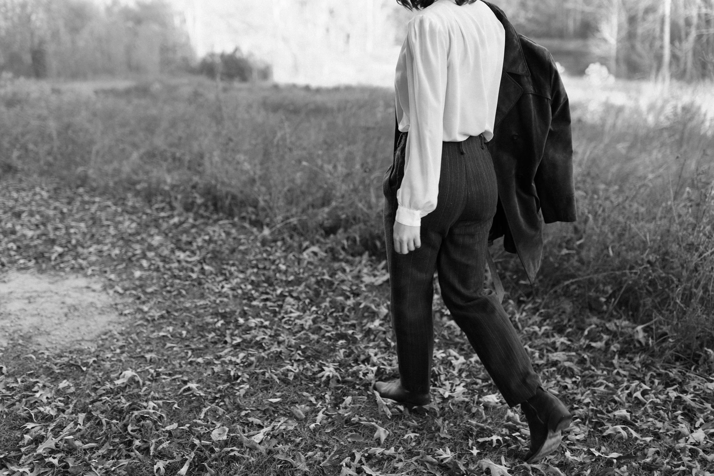 Photo of Helene walking through a leafy path by Mary Bell Photography