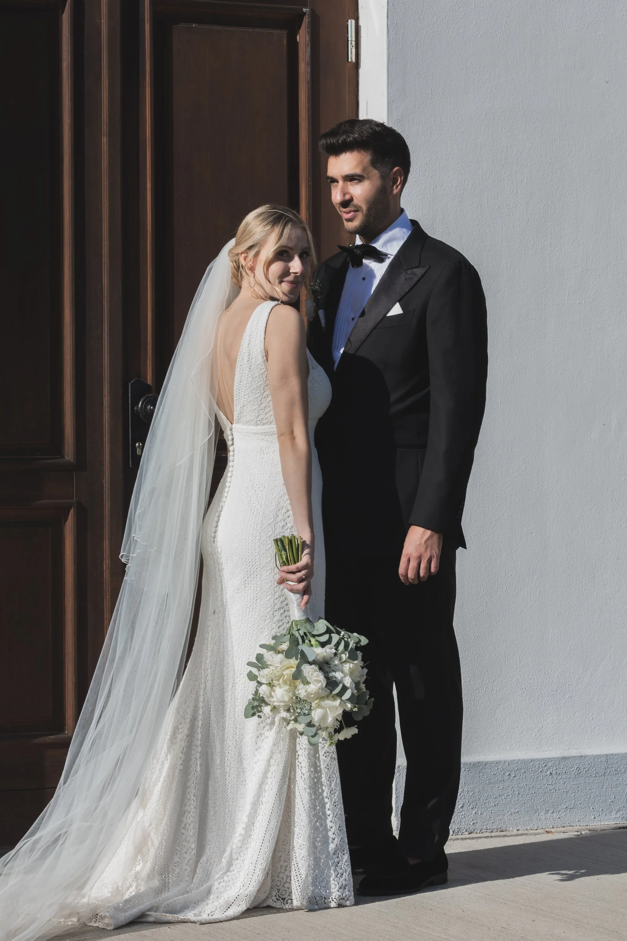 a beautiful wedding couple, white dress, black tuxedo