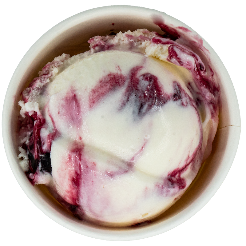 A scoop of berry ice cream with swirls of berry syrup and cream in a white bowl.