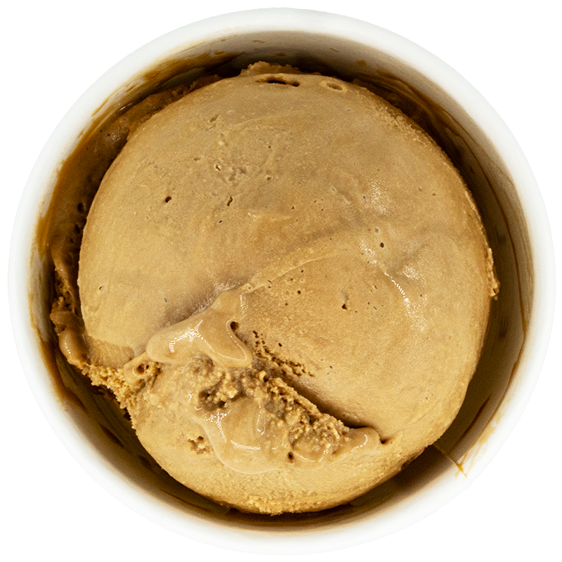 A scoop of coffee-flavored ice cream in a white cup.