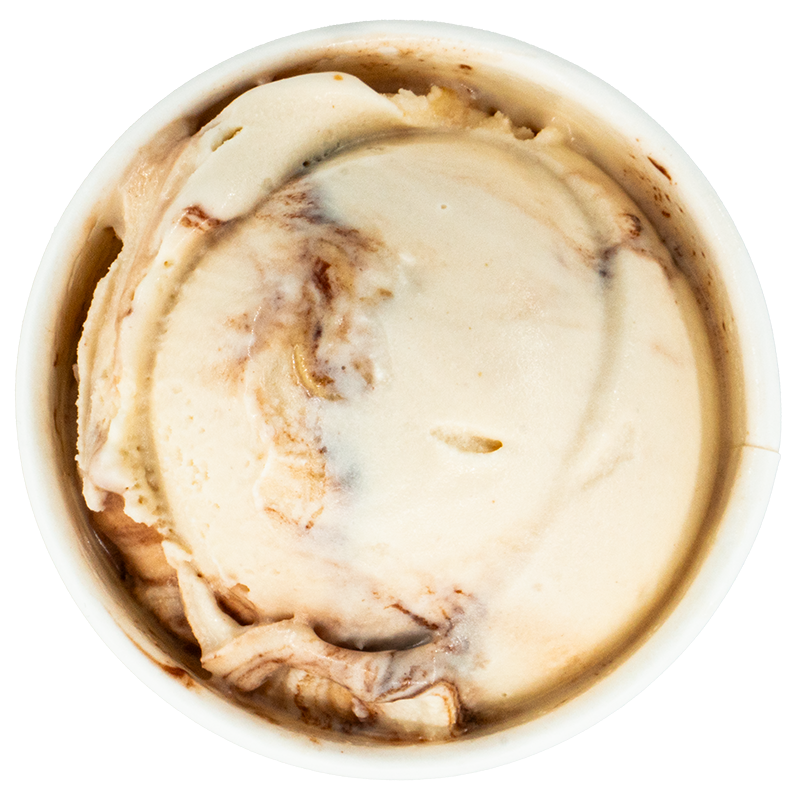 Close-up of a cup of ice cream with visible swirls of chocolate.