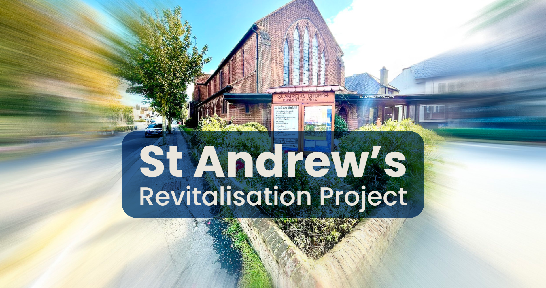A church building with a brick exterior and tall arched windows on a sunny day, surrounded by greenery and a pathway, with a sign over the entrance that reads 'St. Andrew's Church'.