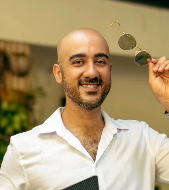 Portrait of a smiling man in a white shirt