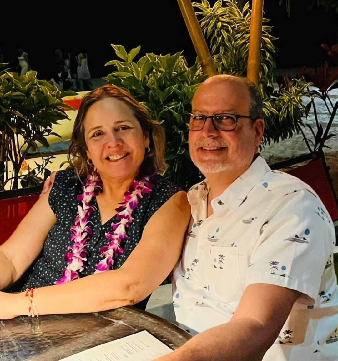 Happy senior couple smiling together during an evening celebration