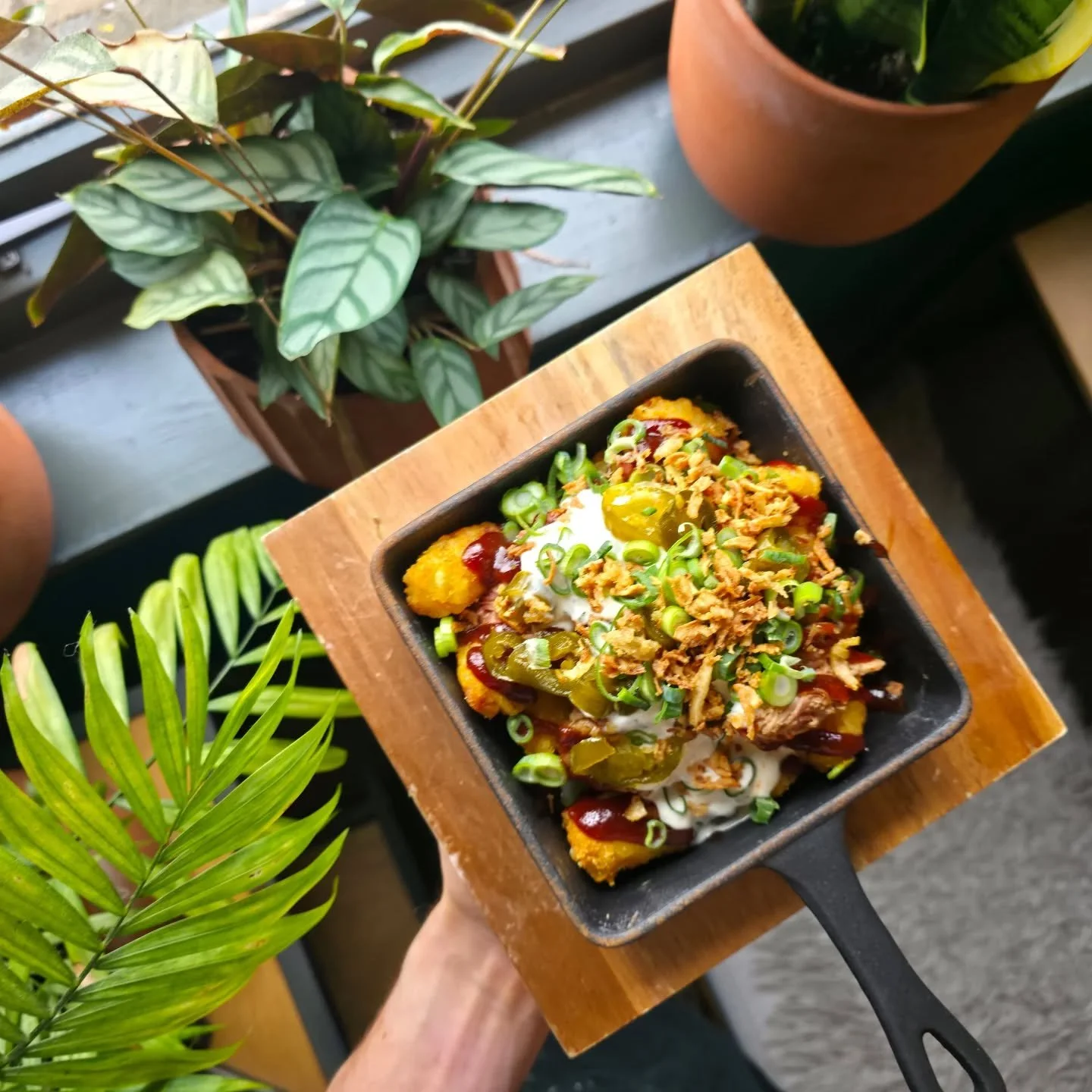 BBQ pulled pork tater tots on the specials: fluffy lil tater tots, topped with in house smoked pork collar, BBQ sauce, smoked cheese sauce, candied jalapenos, ranch dressing, spring onions and crispy onions.