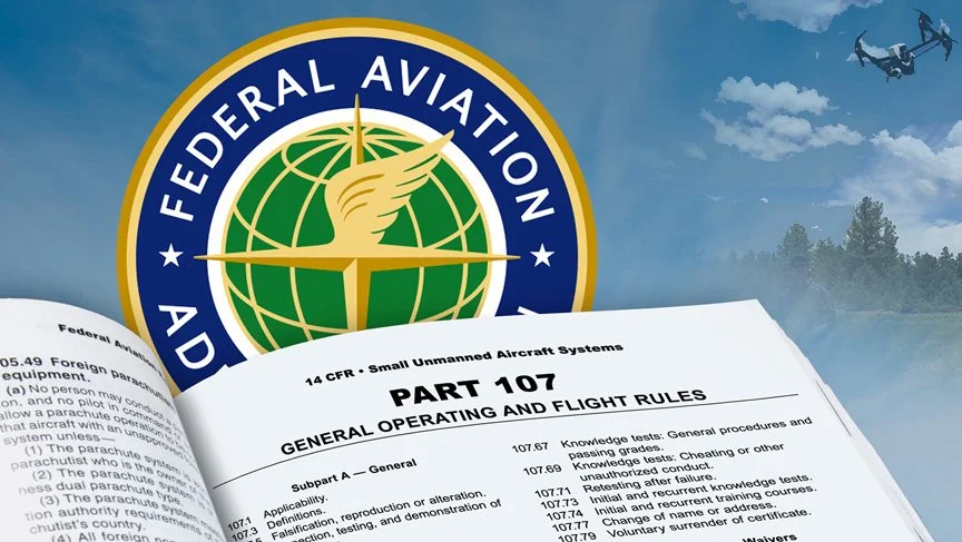 Federal Aviation Administration logo with a globe, wings, and a compass needle, and an open book or manual titled 'Part 107 General Operating and Flight Rules' with text about small unmanned aircraft systems.