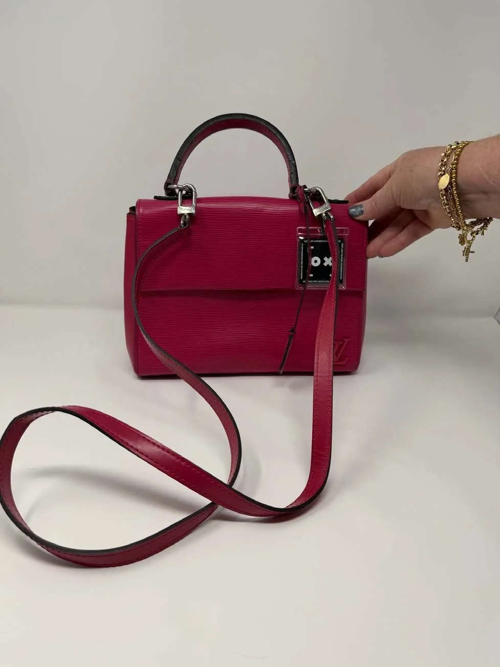 Louis_Vuitton_Epi_Leather_Top-Handle_Crossbody_Bag_(PinkFuchsia)_1.jpg