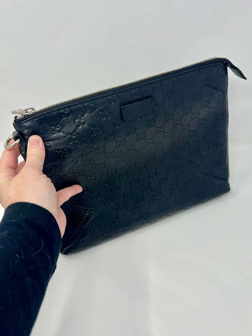 gucci-black-gg-embossed-leather-pouch_02.jpeg