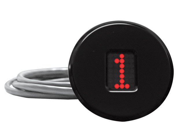 A car key with a black circular key finder displaying the number 1 in red LED lights.