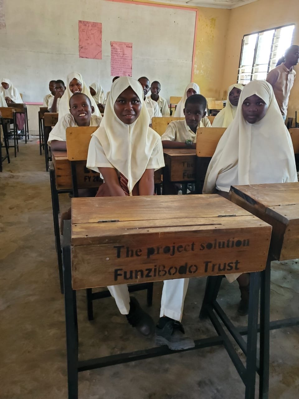  Students in class with the finished desks. 