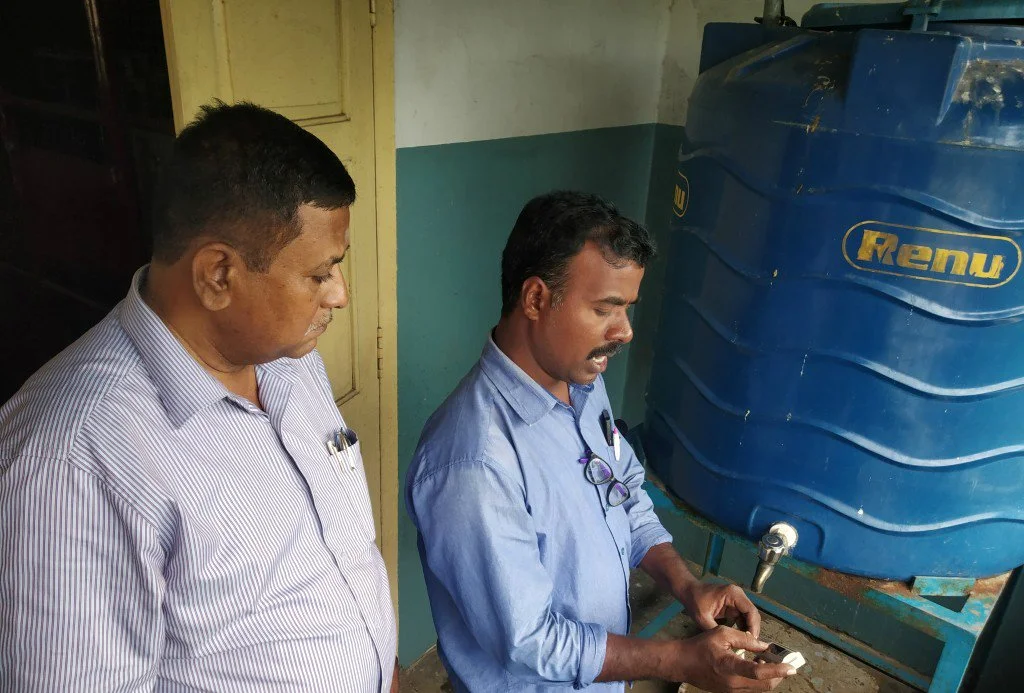  SAVE Trust staff tests water quality at one of the government schools where a new water purification system will be installed. 