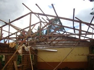  After some heavy rains, the roof is getting framed up to prepare for the metal roofing materials. More classroom space with a new roof means a safe and dry area for education to continue. 