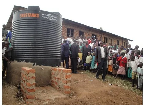  The first water tank has been installed at the Kasinde Primary School in Uganda! Everyone came out for the big celebration and they made quick use of the tank to get their Porridge Feeding Program under way. If you look closely on the above image, y