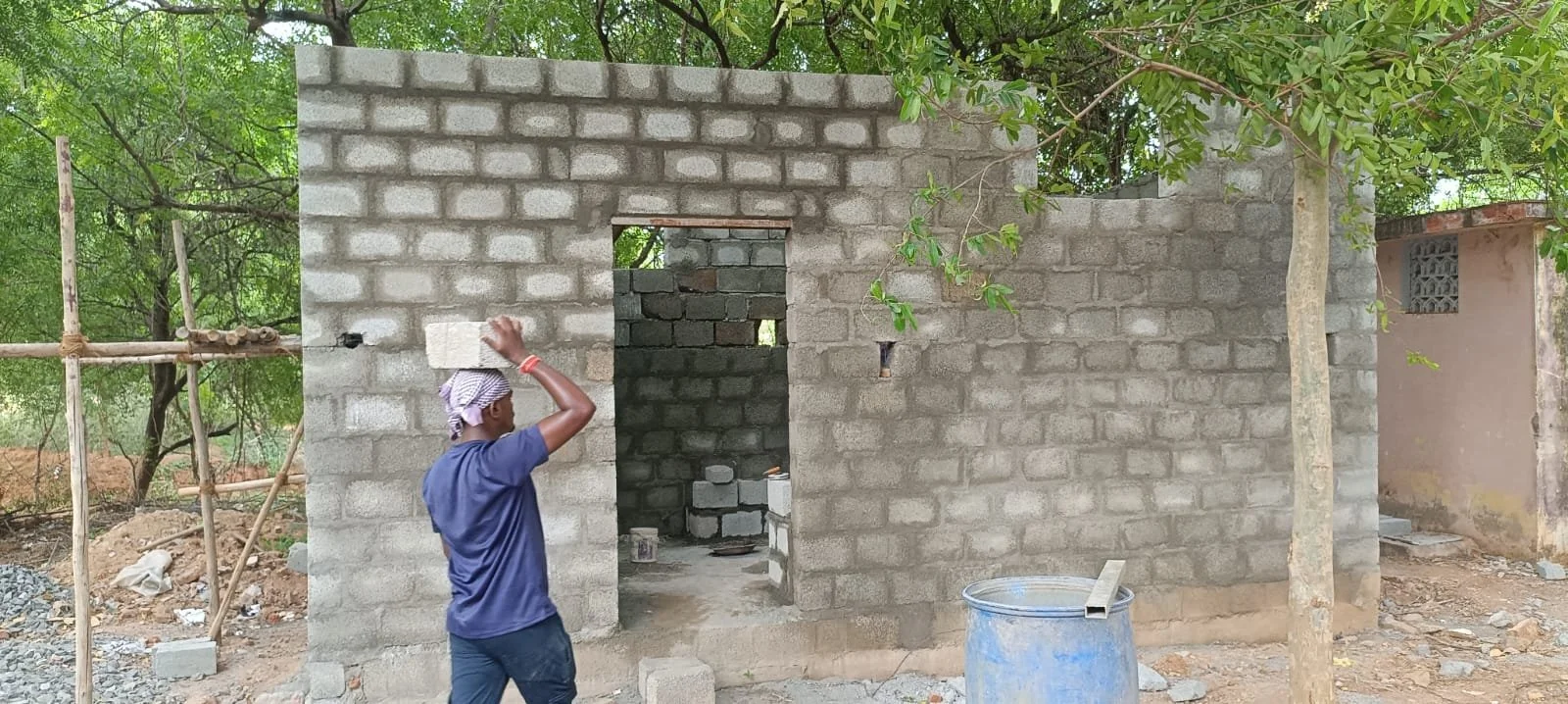  Workers prepare the new walls of the facility. 