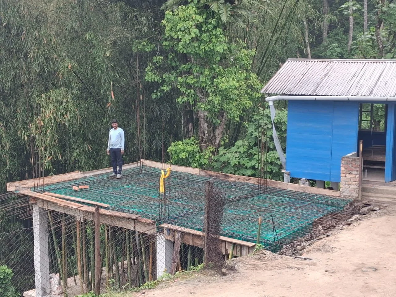  Workers prepare for additional concrete. 
