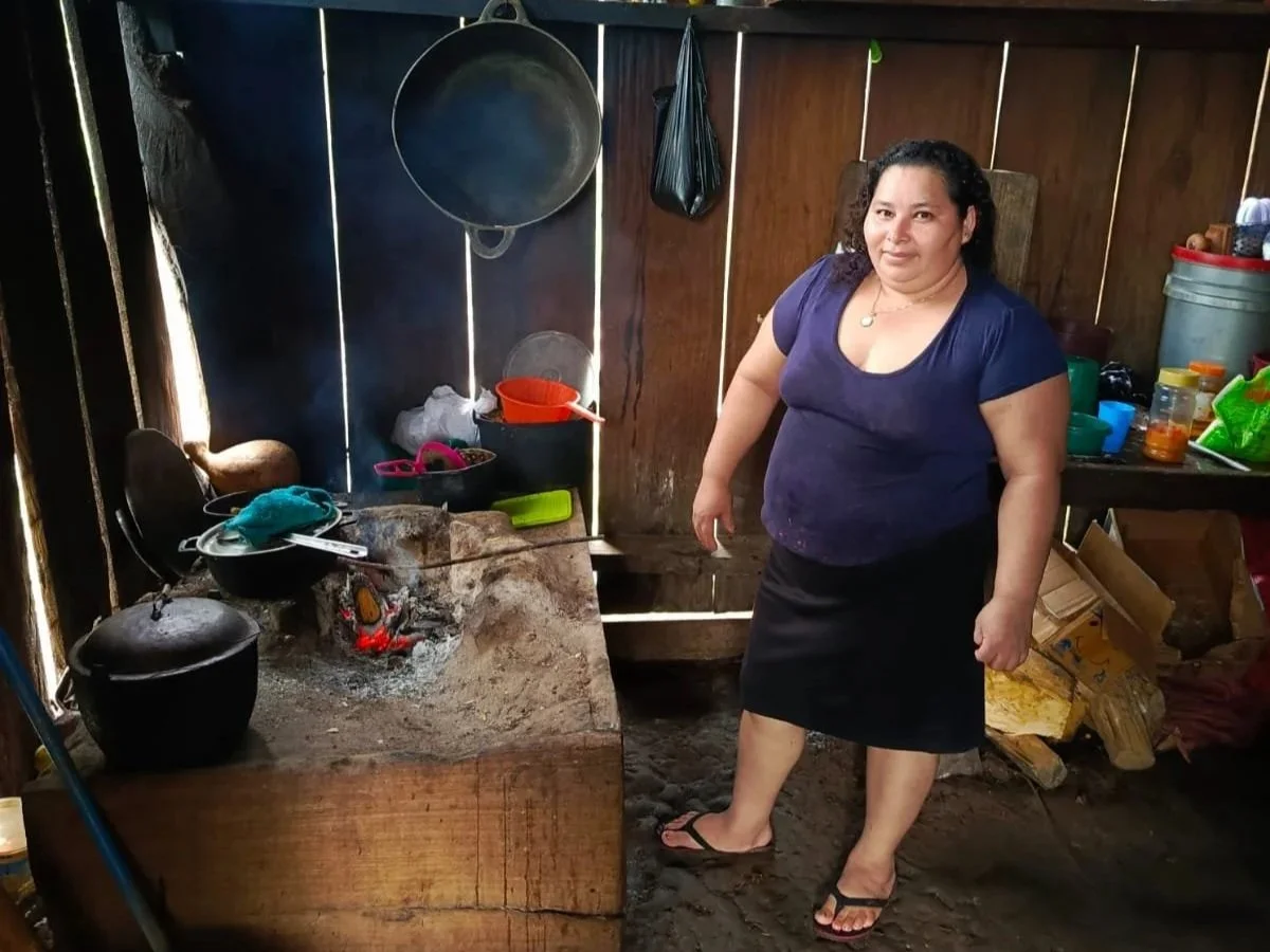 Woman in Nicaragua with an open fire cooking stove